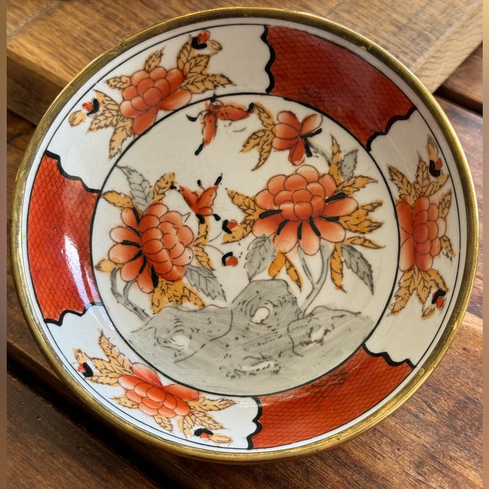 Small Chinese Decorative Dish With Brass on back.